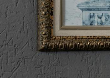 close up of a painting and frame on a wall