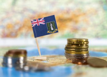 a flag and some money on a map