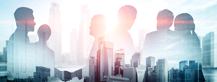 Transparent figures shaking hands in front of a cityscape