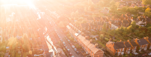 Sunshine rays reaching across rows of houses
